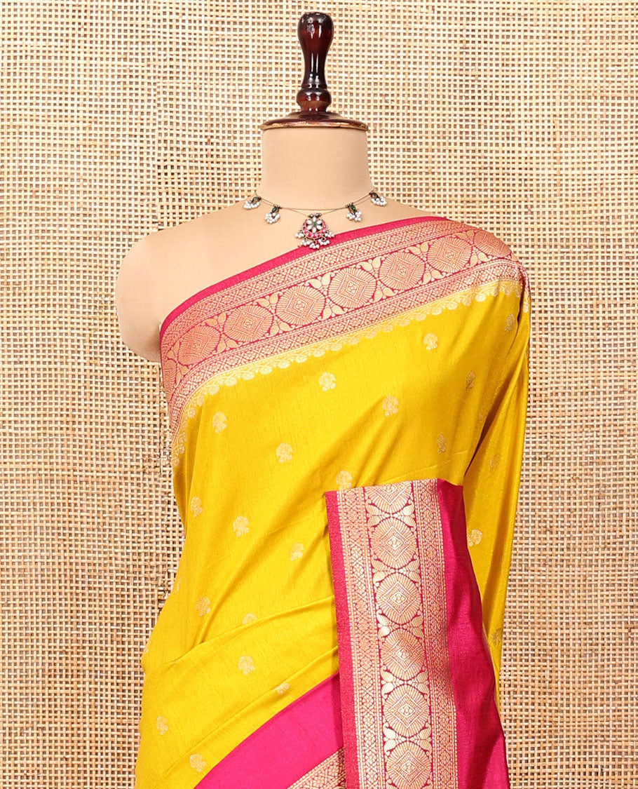 Mustard Yellow Dupion Silk Saree, Embellished with Buttas All Over Its Body, Complemented by Contrast Traditional Border of Paisleys and Chakram Designs, Intricately Designed Pallu, and Paired with a Contrast Blouse