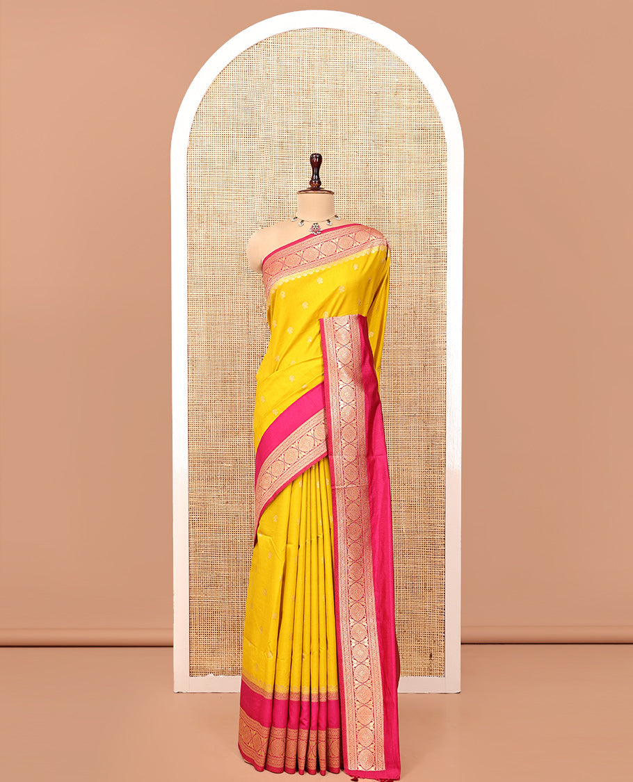 Mustard Yellow Dupion Silk Saree, Embellished with Buttas All Over Its Body, Complemented by Contrast Traditional Border of Paisleys and Chakram Designs, Intricately Designed Pallu, and Paired with a Contrast Blouse