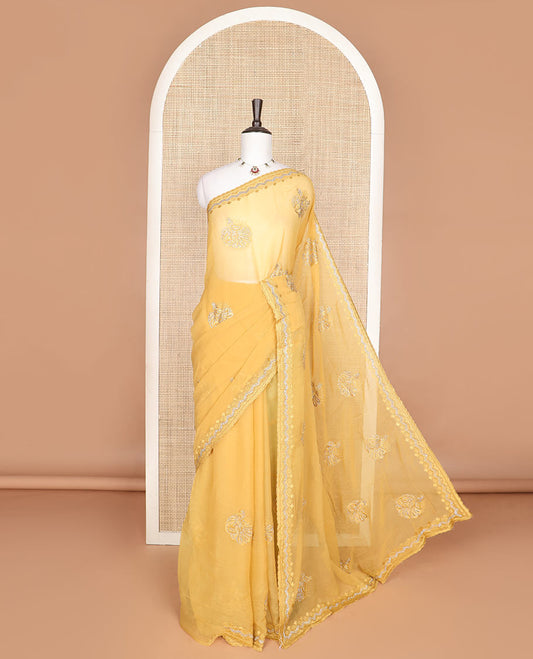 Yellow embroidered designer saree features peacock motifs in micro-stone, scallop thread & stone embroidery border