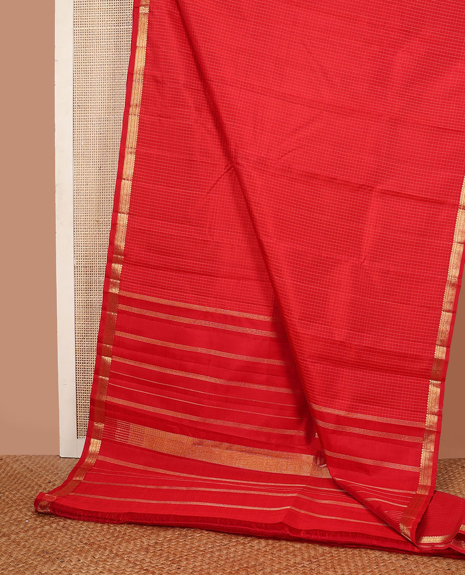 Red checked Kanchipuram silk saree, self-border of thilakam mokku,muthu, diamond & chakram designs & seppu rekku pallu