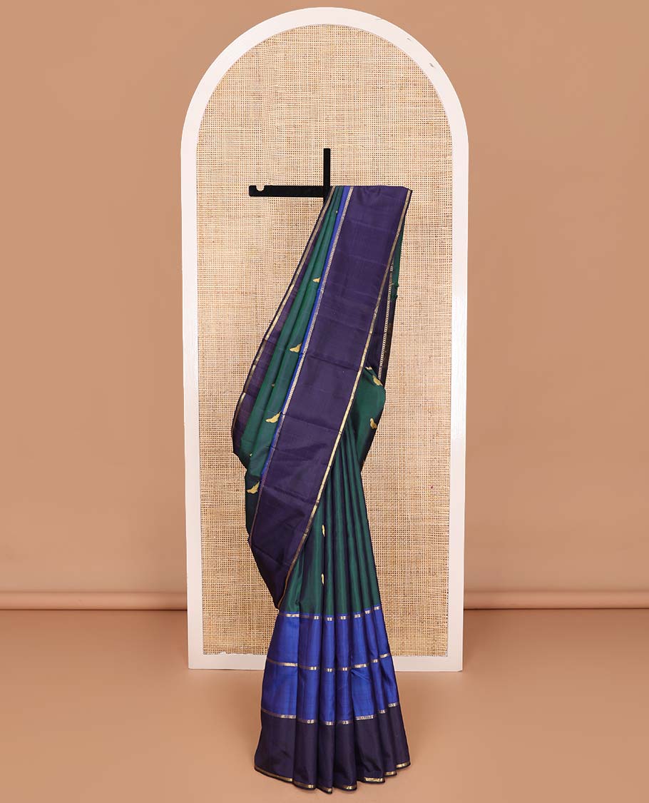 Green kili buttas Kanchipuram silk saree, contrast border of lavangam, muthu, neli, ara bogudi, and kathir stripes, and kathir design pallu