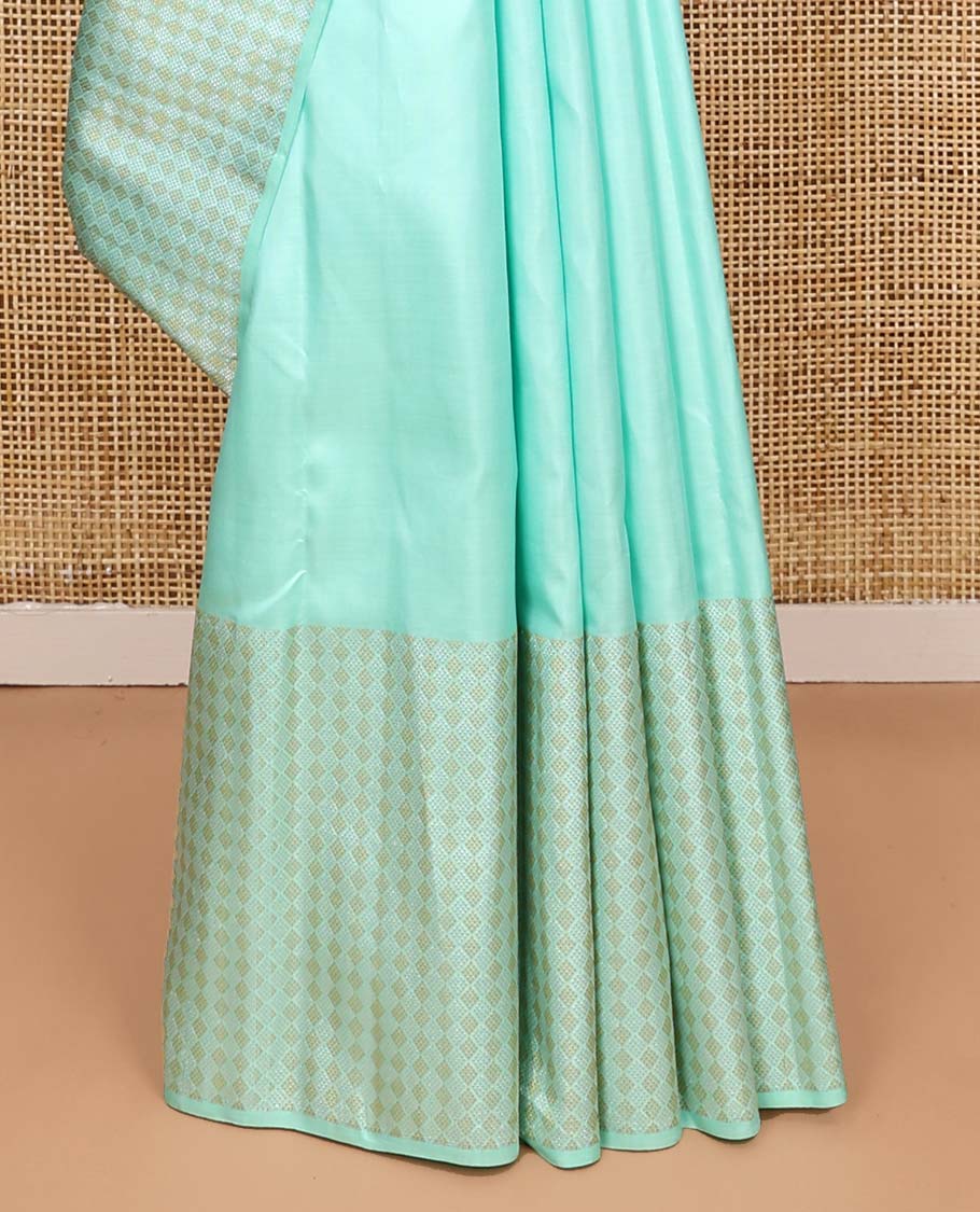 Turquoise zari buttas Kanchipuram silk saree, zari border of jaal designs, and contrast jaal pallu