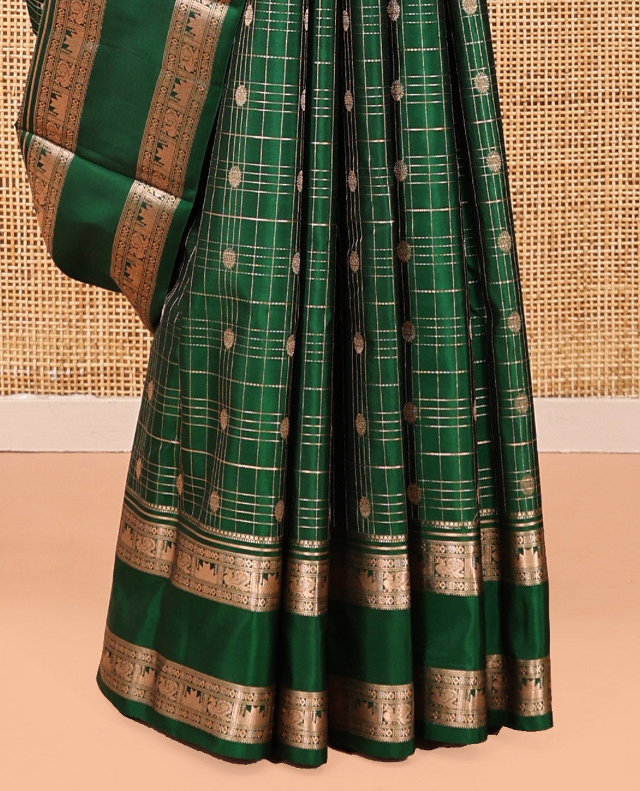 Green Kanchipuram Silk Saree, Detailed with Buttas and Checks, a Zari Rettai Pettu Border of Thazampoo Rekku, and Mayil Designs, Grand Pallu, and a Matching Blouse