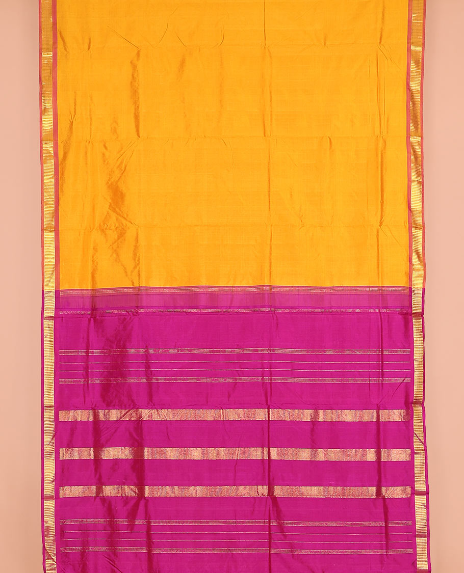 Mango yellow plain nine-yard silk saree, contrast border of Muthu designs, and pallu of zari designs