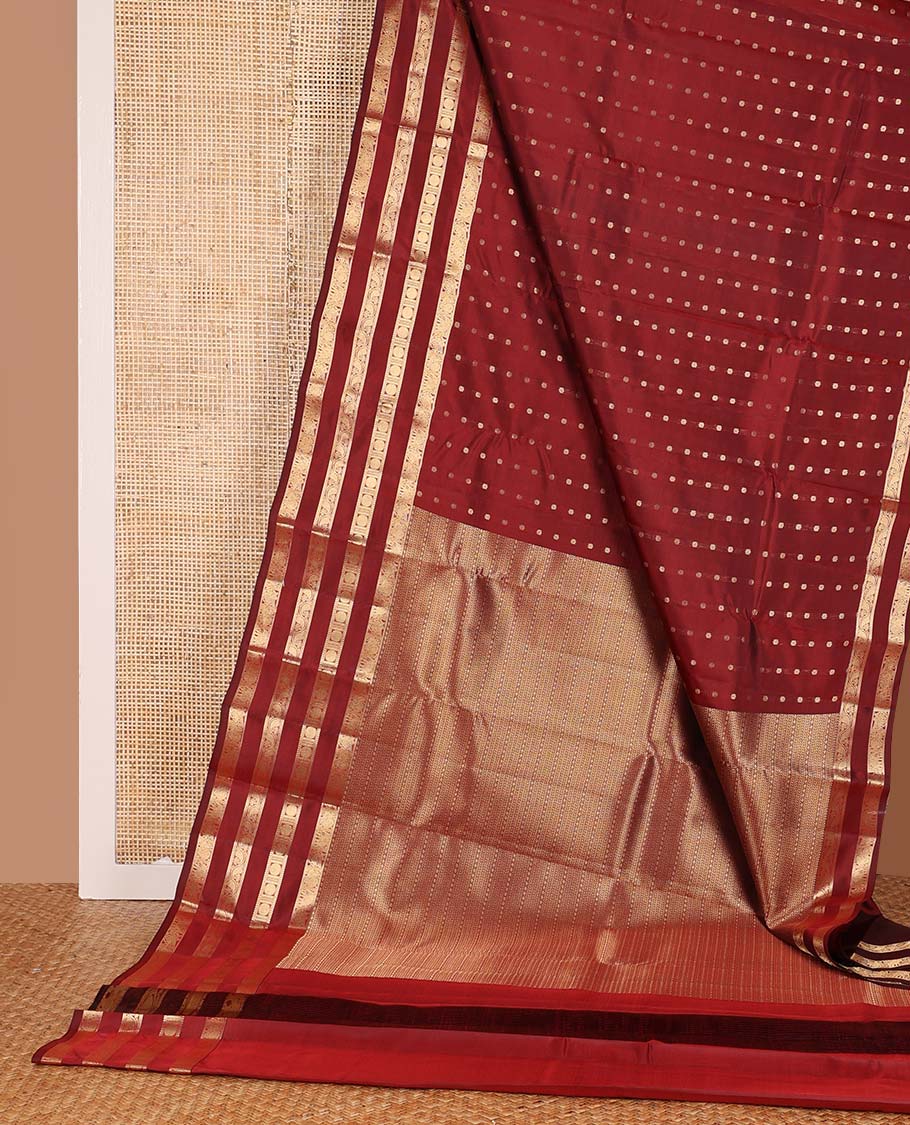 Red zari buttas Vasundhara silk mix saree, zari border of kuthirai, mayil, yaanai, neli, muthu, paisa, and kodi manga designs, and geometric pallu