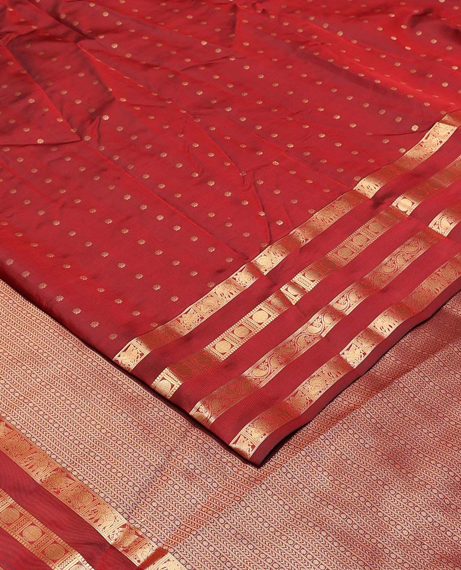 Red zari buttas Vasundhara silk mix saree, zari border of kuthirai, mayil, yaanai, neli, muthu, paisa, and kodi manga designs, and geometric pallu