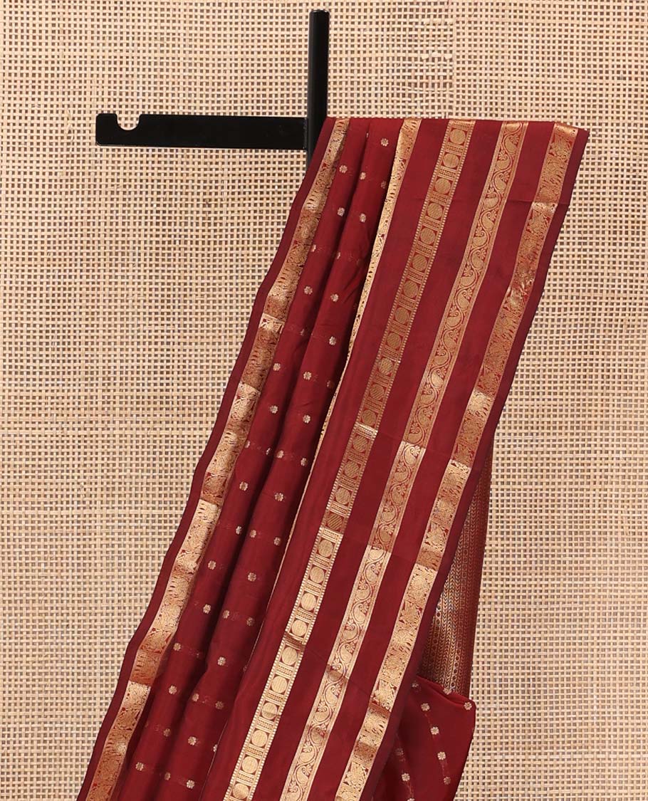 Red zari buttas Vasundhara silk mix saree, zari border of kuthirai, mayil, yaanai, neli, muthu, paisa, and kodi manga designs, and geometric pallu