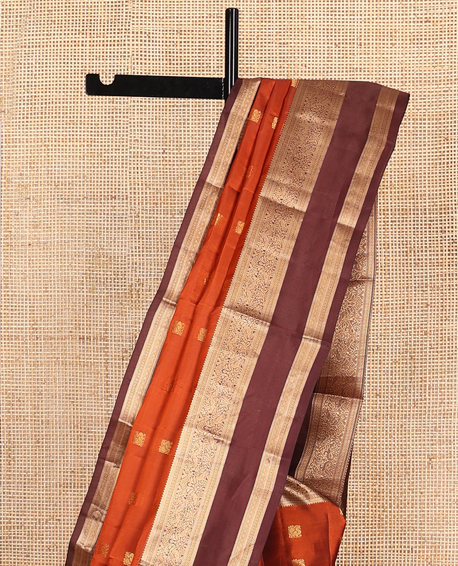 Rust Orange Vasundhara Lite-Silk Mix Saree Showcasing Mayil Buttas, Complemented with a Contrast Rettai Pettu Border Featuring Muthu, Diamond, and Mayil Designs, Adorned with Jaal Pallu, and a Contrast Blouse