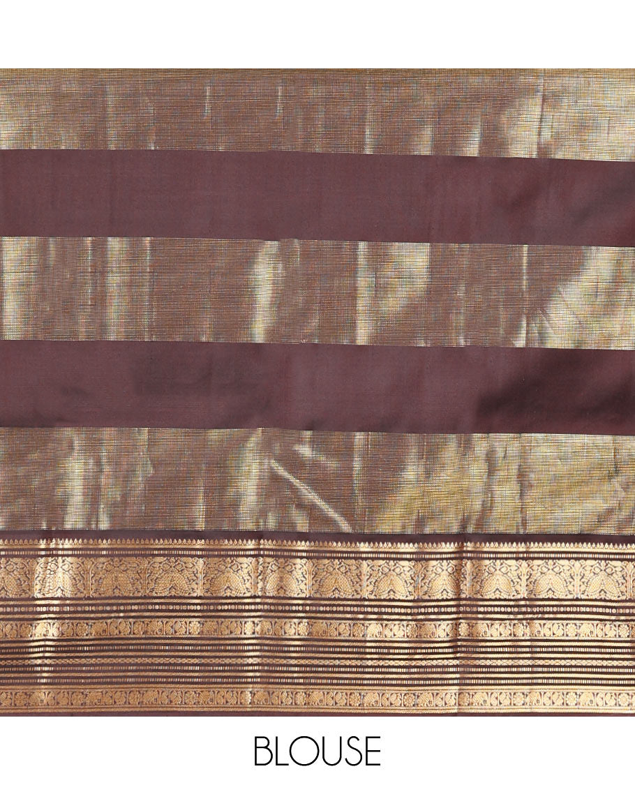 Red Vasundhara Silk Saree, Accentuated with Zari Buttas and Zari Stripes All Over Its Body, Complemented by a Contrast Border of Thilakam, Banaras, Muthu, Yaanai, Manga, and Mayil Designs, Zari Elevated Jaal Pallu, and Paired with a Contrast Blouse