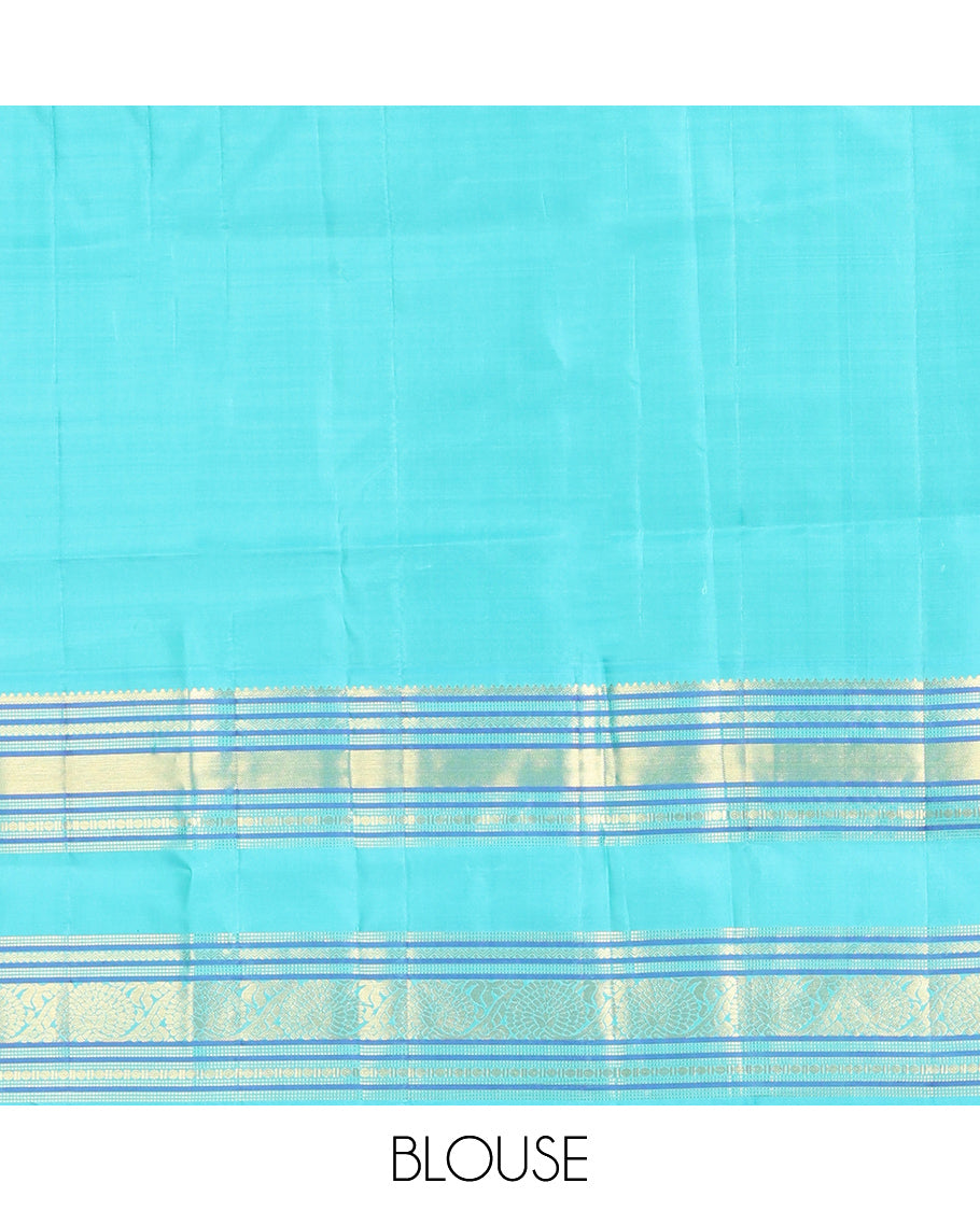 Tomato Red and Blue Vasundhara Silk Saree, Subtly Sparkled With Pattu Nool Kattam On Its Body, Complemented by Contrast Rettai Pettu Border of Salngai, Muthu, Neli, Rudraksham, and Dhavana Kodi Designs, Grand Pallu and Paired with a Contrast Blouse