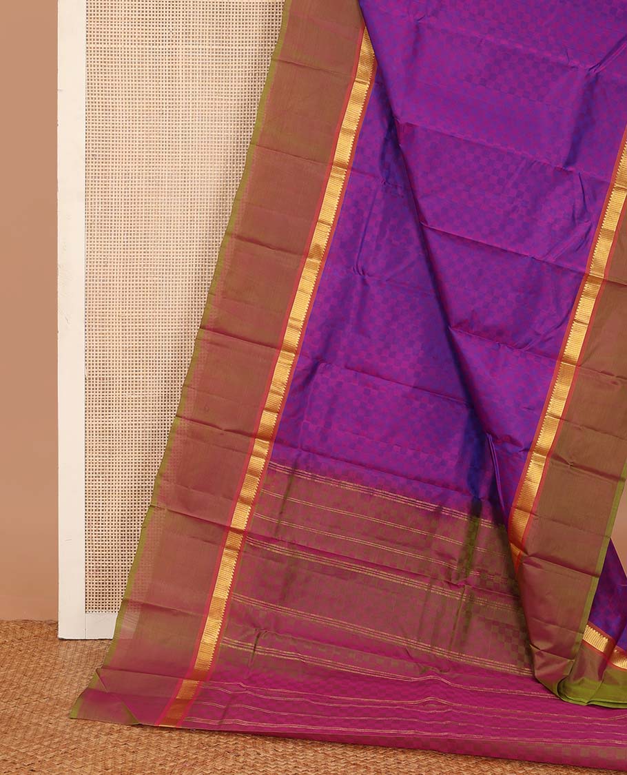 Violet paiyadi kattam Kanchipuram silk saree, contrast border of rekku, and vanki designs, and sparsely checked pallu