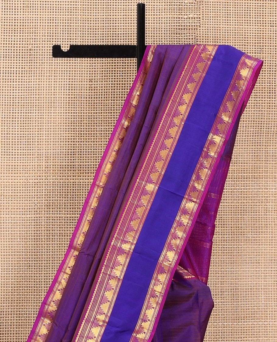 Brown Kanchipuram Silk Saree Adorned with Vazhaipoo Stripes, Complemented by a Contrast Rettai Pettu Border of Thilakam Mokku, Muthu, Neli, and Thazampoo Rekku Designs, Sparsely Woven Pallu, and Paired with a Contrast Blouse