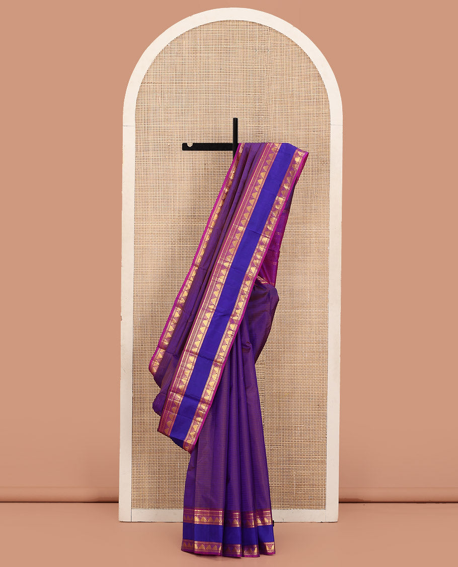 Brown Kanchipuram Silk Saree Adorned with Vazhaipoo Stripes, Complemented by a Contrast Rettai Pettu Border of Thilakam Mokku, Muthu, Neli, and Thazampoo Rekku Designs, Sparsely Woven Pallu, and Paired with a Contrast Blouse