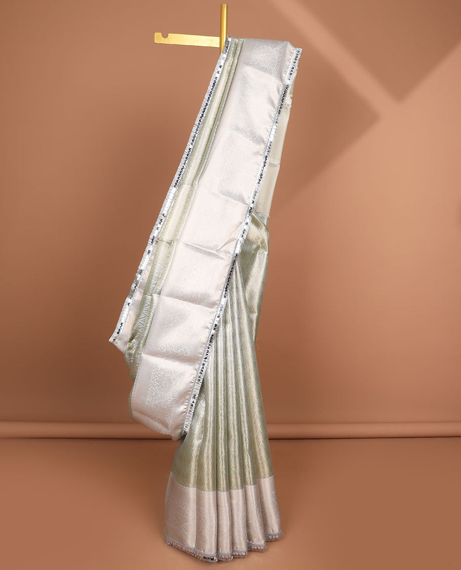 Light green jacquard tissue saree with self floral zari design border & intricate zari design pallu