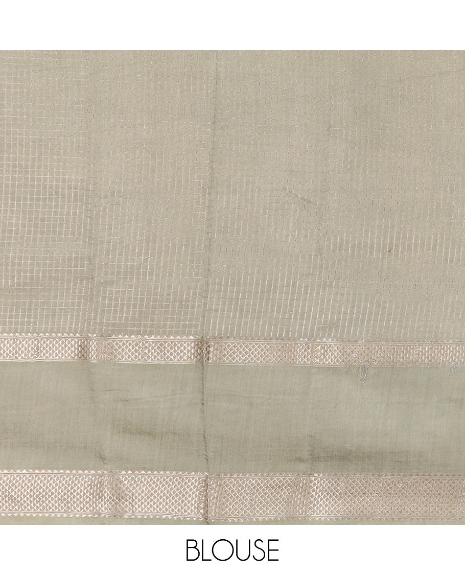 Dark Green Assam Silk Saree Sparsely Sparkled with Zari Checks, Complemented by Contrast Zari Border of Triangle Motifs, a Gleaming Pallu of Zari Stripes, and Paired with a Contrast Blouse