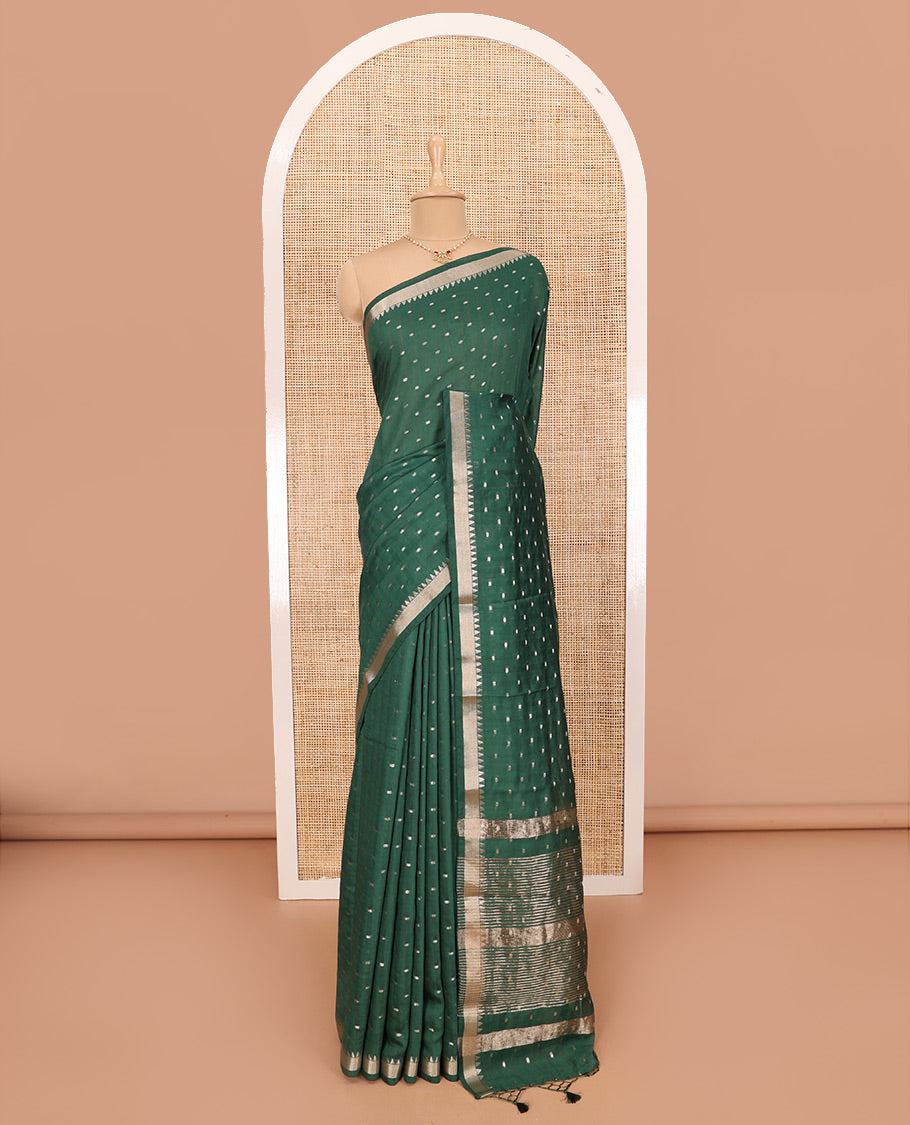 Green Assam Silk Saree Features Bright Zari Buttas All Over Its Body, a Subtle Temple Zari Border, a Pallu Highlighted with Zari Stripes, and Comes with a Matching Blouse