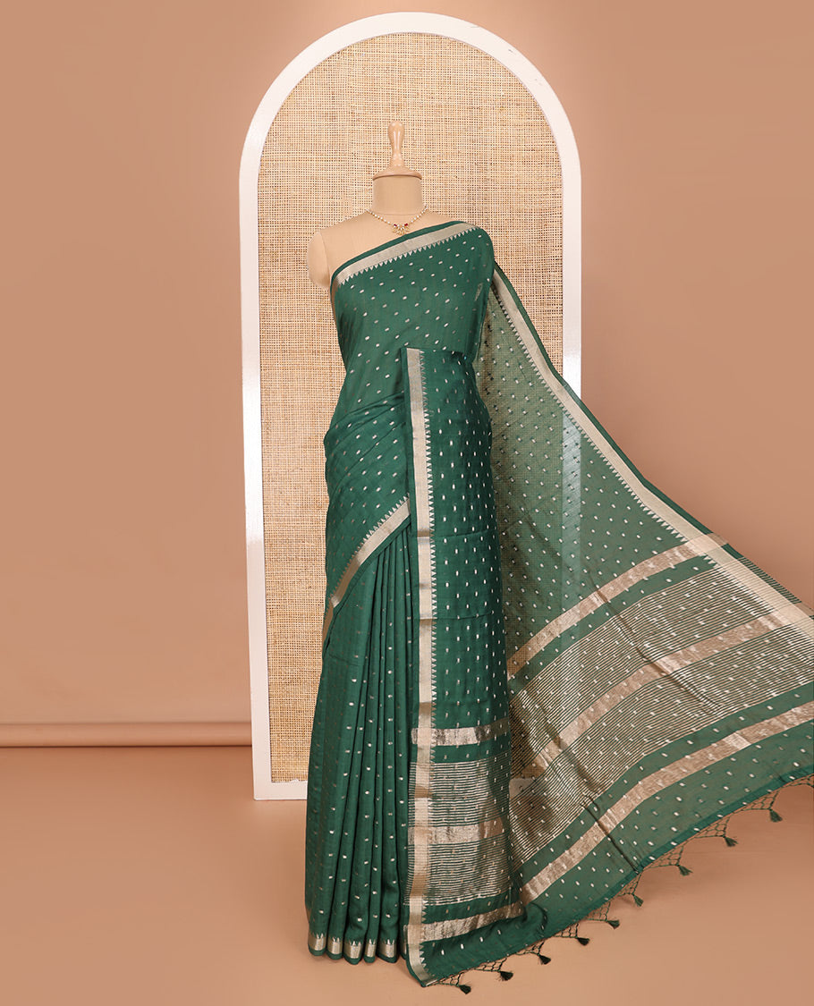 Green Assam Silk Saree Features Bright Zari Buttas All Over Its Body, a Subtle Temple Zari Border, a Pallu Highlighted with Zari Stripes, and Comes with a Matching Blouse
