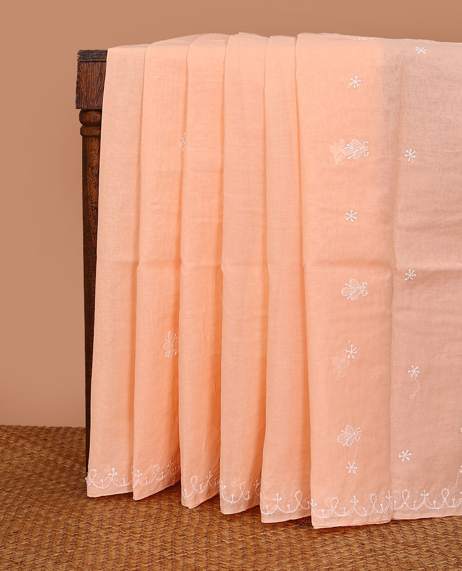 Light orange embroidered buttas Lucknowi chikankari saree, thread embroidered border, and floral-paisley motifs embroidered pallu