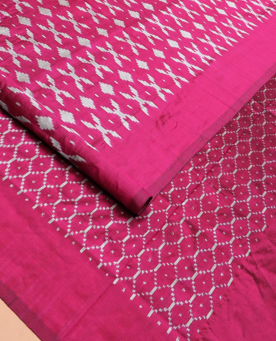 Purple Ikkat Silk Saree Decked with Ikkat Buttas, Featuring a Subtle Plain Border, Complemented by a Pallu Woven in an Ogee Pattern with Ikkat Texture