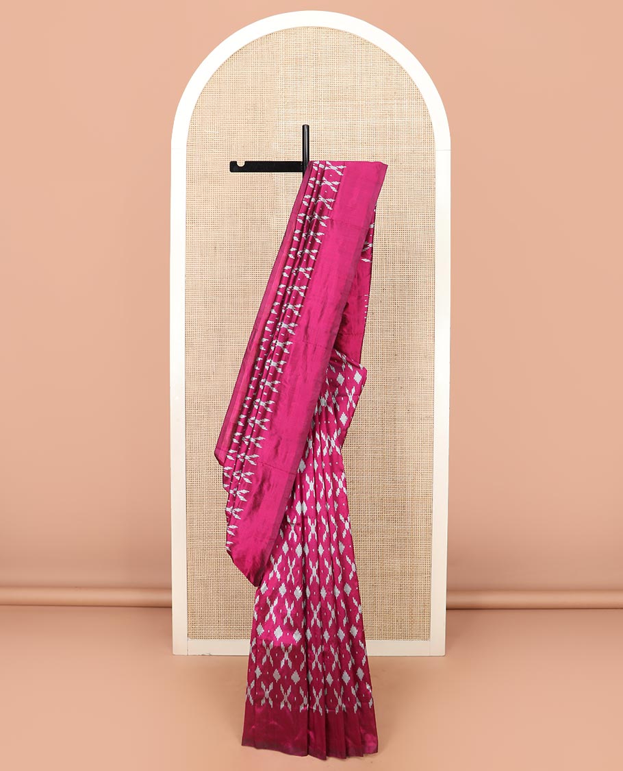 Purple Ikkat Silk Saree Decked with Ikkat Buttas, Featuring a Subtle Plain Border, Complemented by a Pallu Woven in an Ogee Pattern with Ikkat Texture