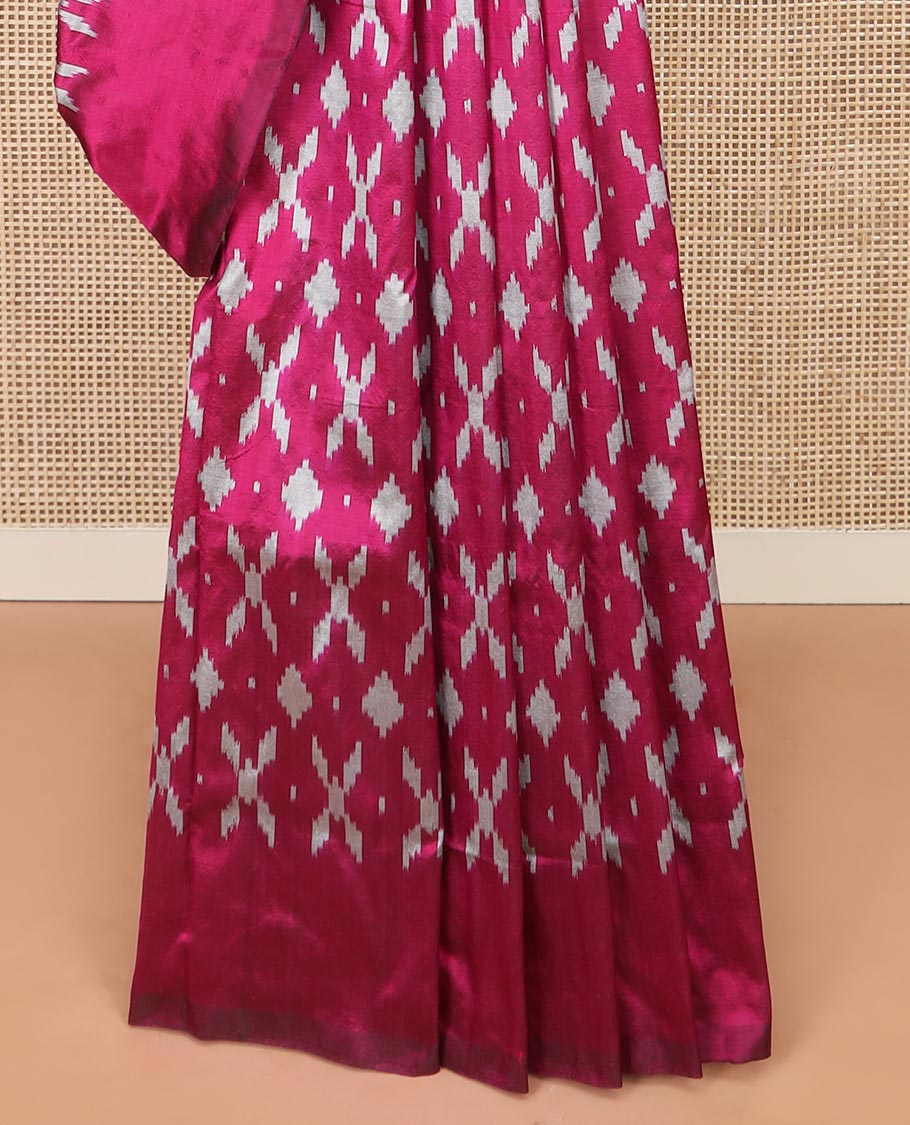 Purple Ikkat Silk Saree Decked with Ikkat Buttas, Featuring a Subtle Plain Border, Complemented by a Pallu Woven in an Ogee Pattern with Ikkat Texture