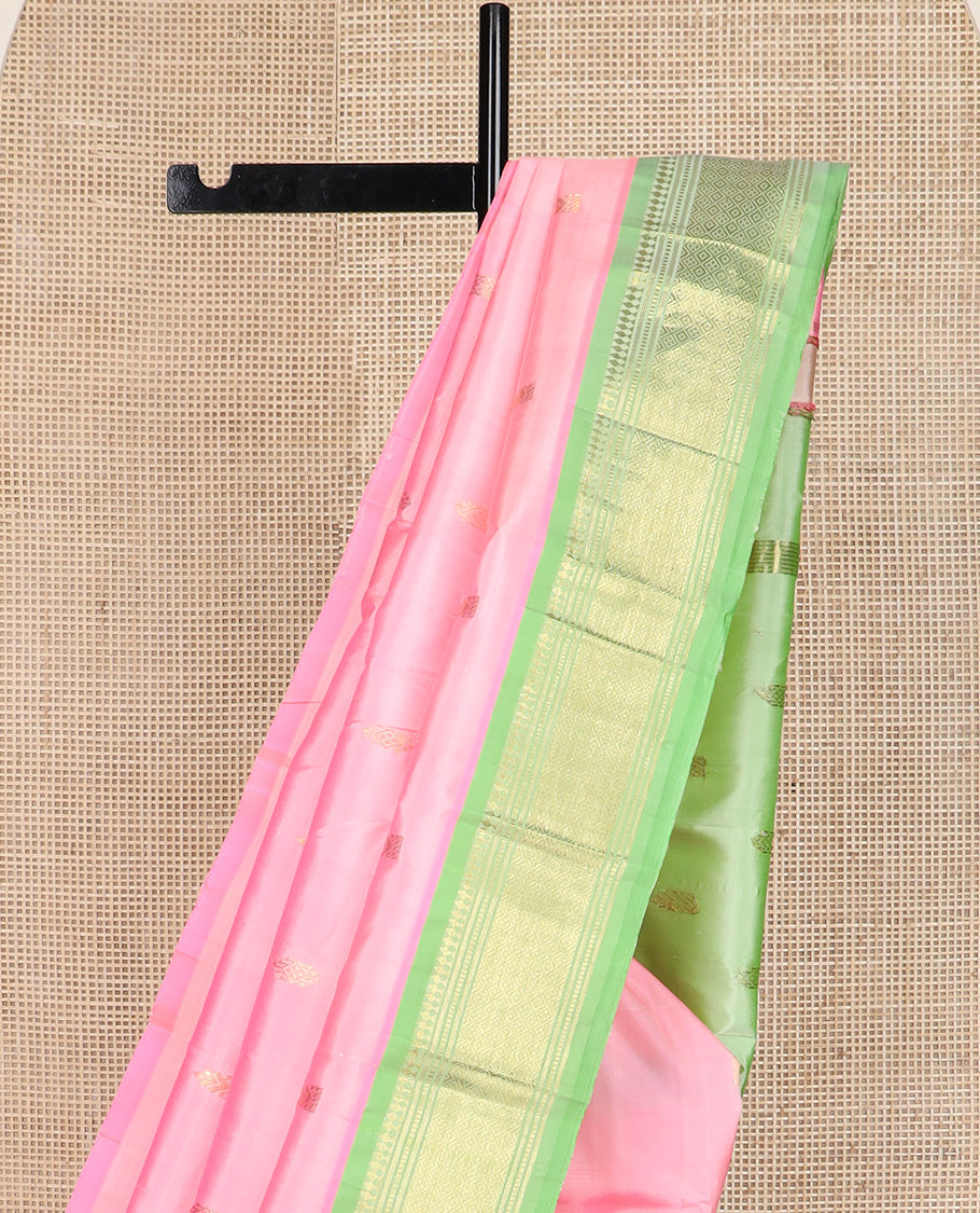 Pink zari buttas Kanchipuram silk saree, contrast one-sided border of paneer sombu, banaras, muthu, and jaal design, and zari woven pallu