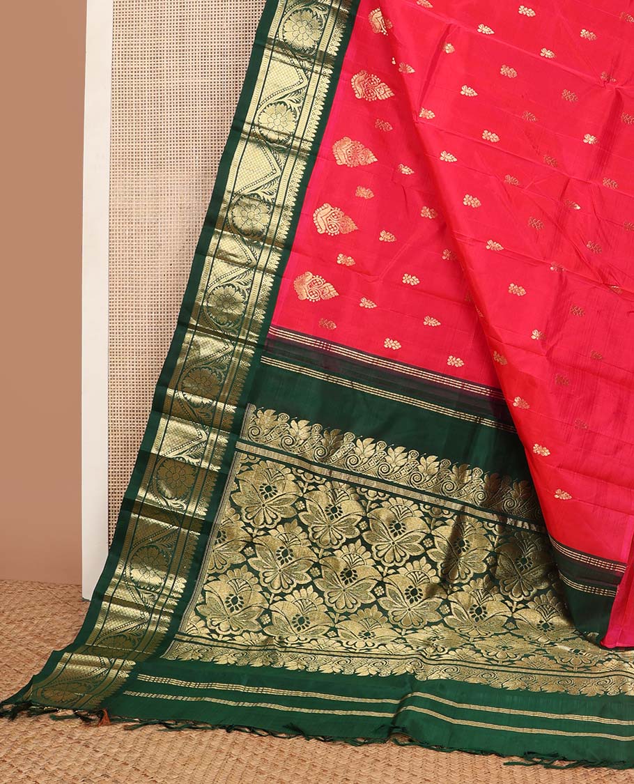Red buttas kancheepuram silk saree with contrast border of thilakam mokku, banaras, muthu design & floral pallu