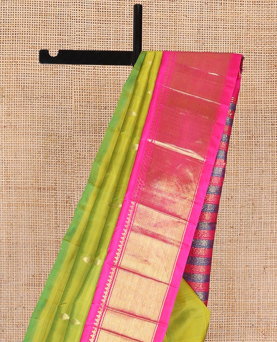 Green kancheepuram silk saree with zari buttas, contrast one-sided korvai border of salngai, banaras & mayil kann & zari-rich pallu of kodi visiry designs