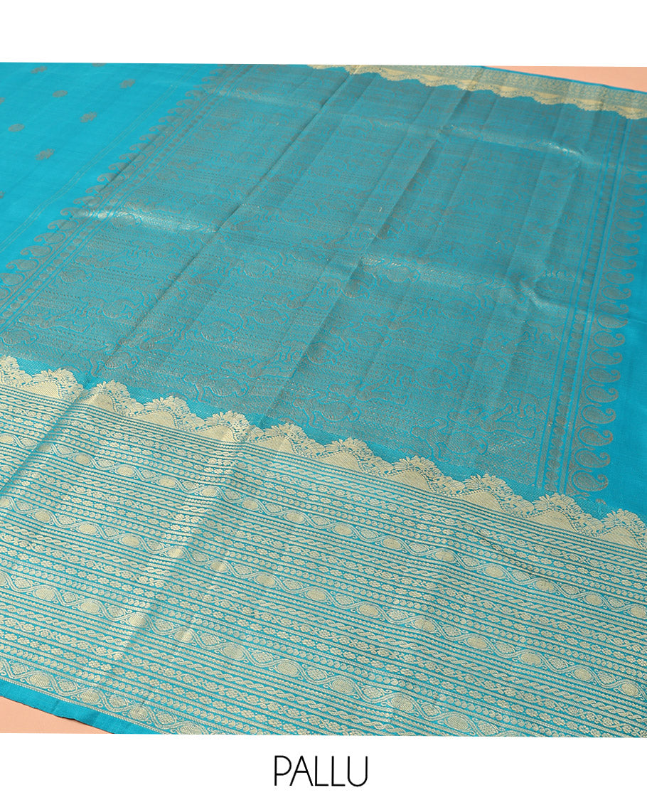 Blue Kanchipuram Silk Saree, Decorated with Iruthalai Pakshi Buttas All Over Its Body, Highlighted by a Zari Border of Puli Nagam, Manga, Kamalam, and Kodi Visiry Designs, Pallu of Human Figurines, and Paired with a Matching Blouse