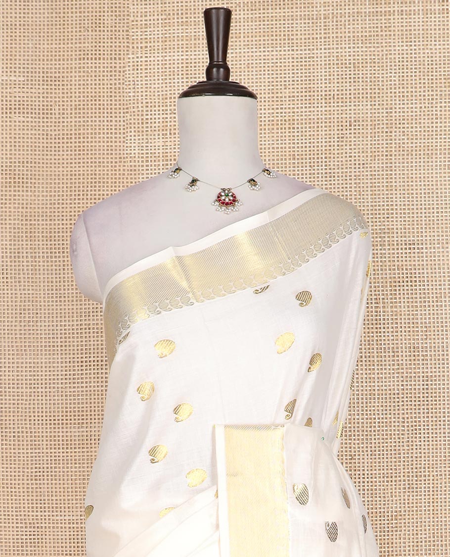 Cream paisley zari buttas Kerala cotton saree, paisley zari border, and zari paisley pallu