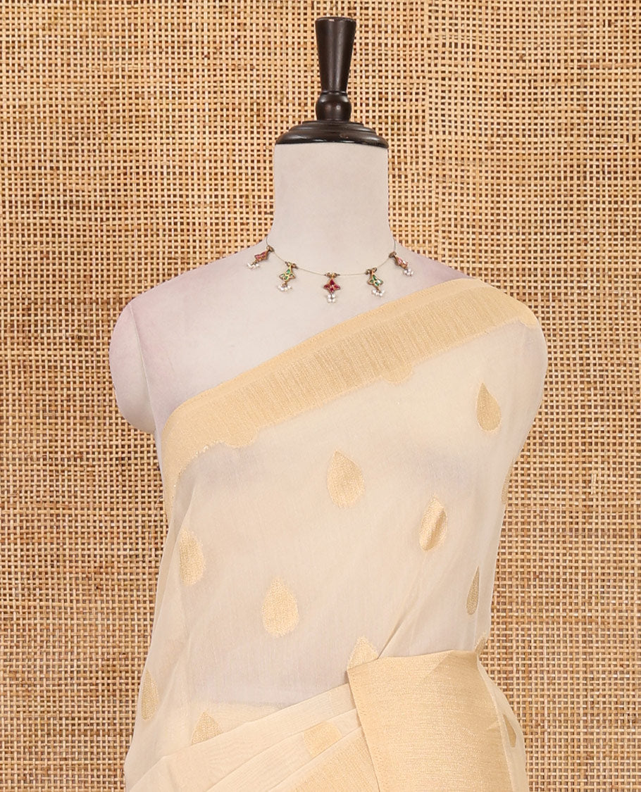 Cream gold zari thilakam motifs woven Tissue chanderi saree, gold zari bavanji border, plain pallu & brocade blouse