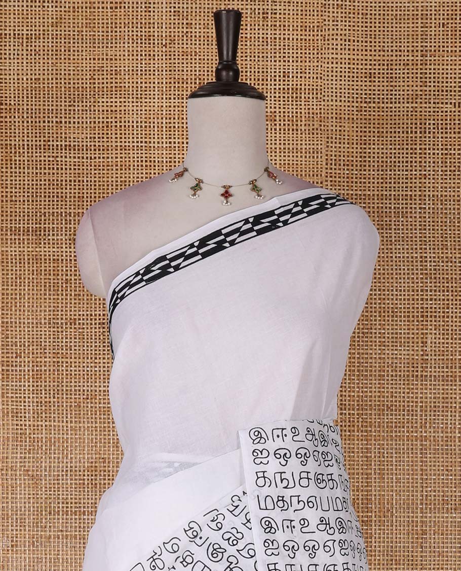 Borderless half-white and black Tamil letters printed Sungudi cotton saree with contrast Tamil letters printed blouse
