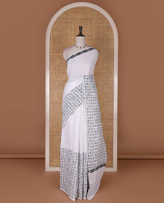 Borderless half-white and black Tamil letters printed Sungudi cotton saree with contrast Tamil letters printed blouse