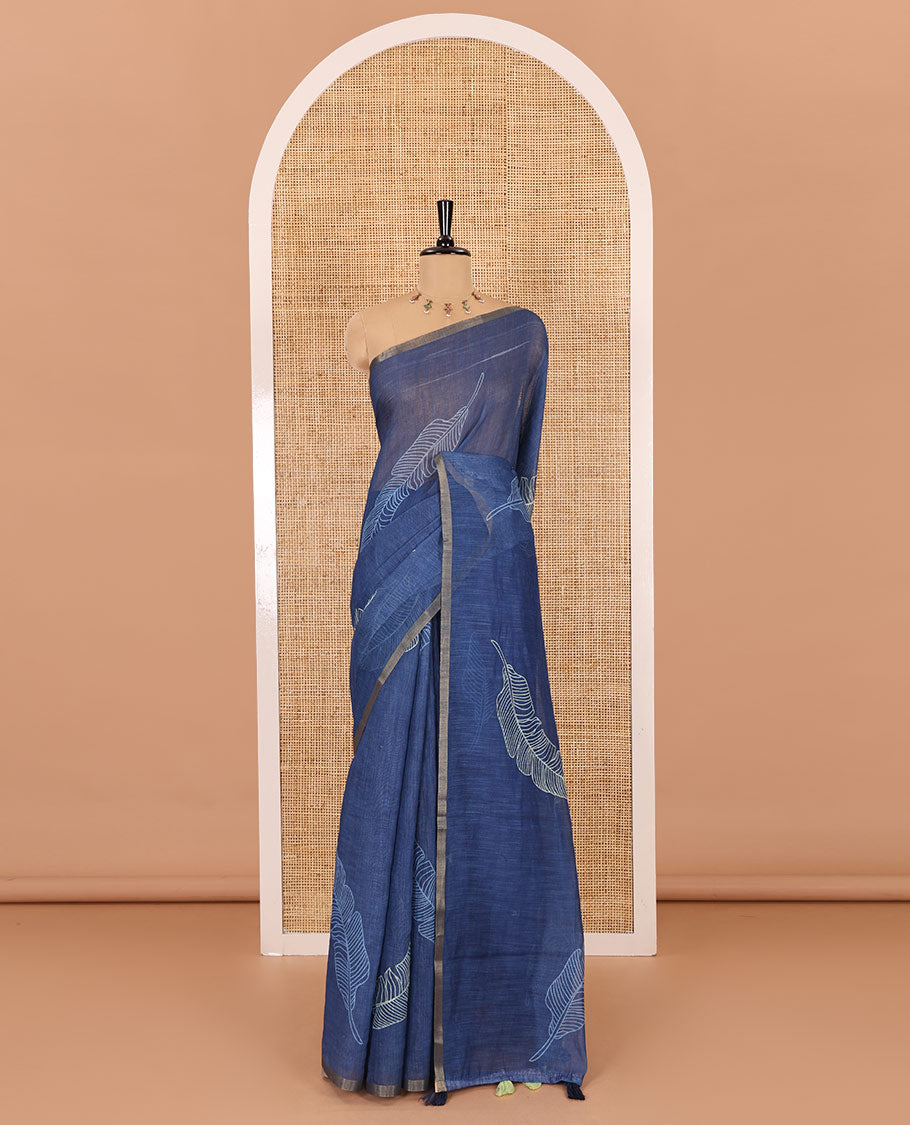 Indigo big feather motifs printed linen cotton saree, piping border, feather motifs printed pallu, and a contrast feather motifs printed blouse