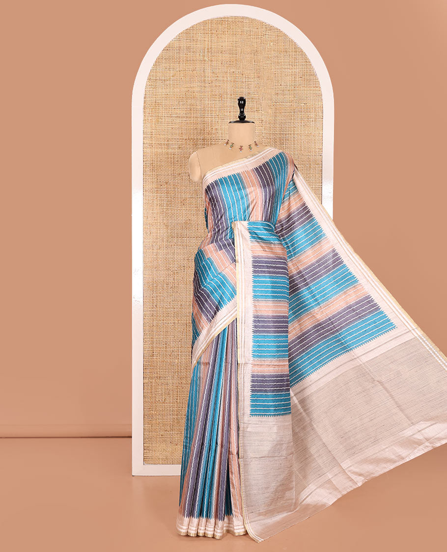 Blue Semi-Tussar Saree Colorfully Printed with Zig-Zag Stripes, Subtly Woven with a Resham Thread Temple Border, Featuring a Heathered Pallu, Paired with a Contrast Striped Blouse