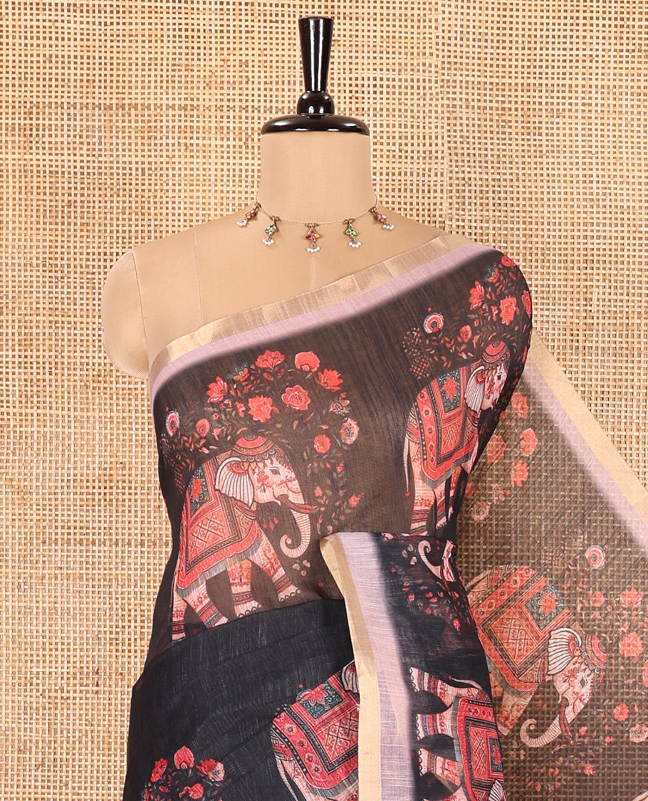Black Plain Linen Cotton Saree, Artfully Detailed with Elephant Motifs on Piping Border, Pallu of Elephant Motifs Print, and Paired with a Contrast Blouse