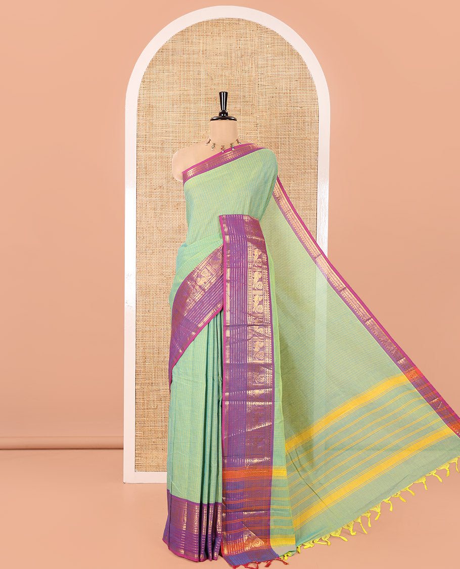 Sea Green Chettinad Cotton Saree, Subtly Sparkled with Stripes on Its Body, Complemented by a Contrast Traditional Design Zari Border, Subtly Striped Pallu, and Paired with a Matching Blouse
