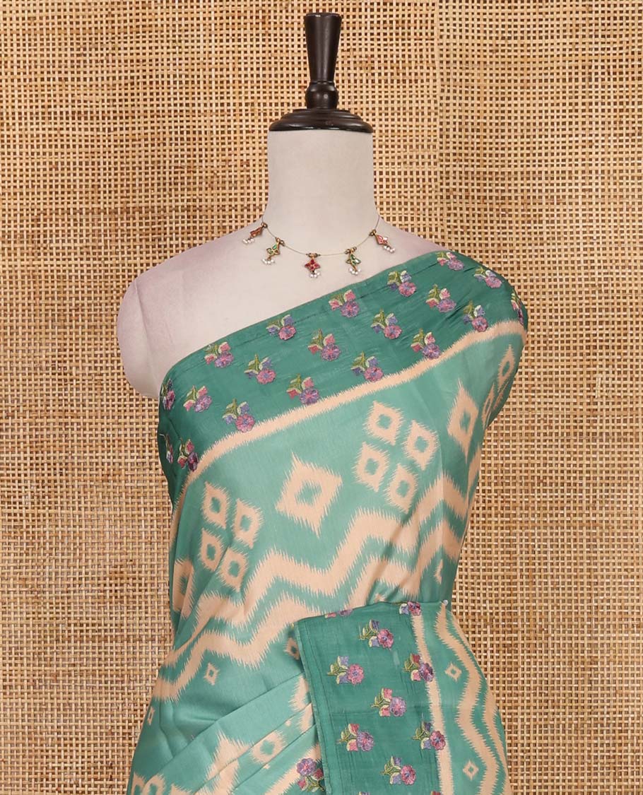Green pochampally ikkat style geometric printed fancy tussar saree, contrast floral motifs thread embroidered border, ikkat printed pallu, and plain blouse