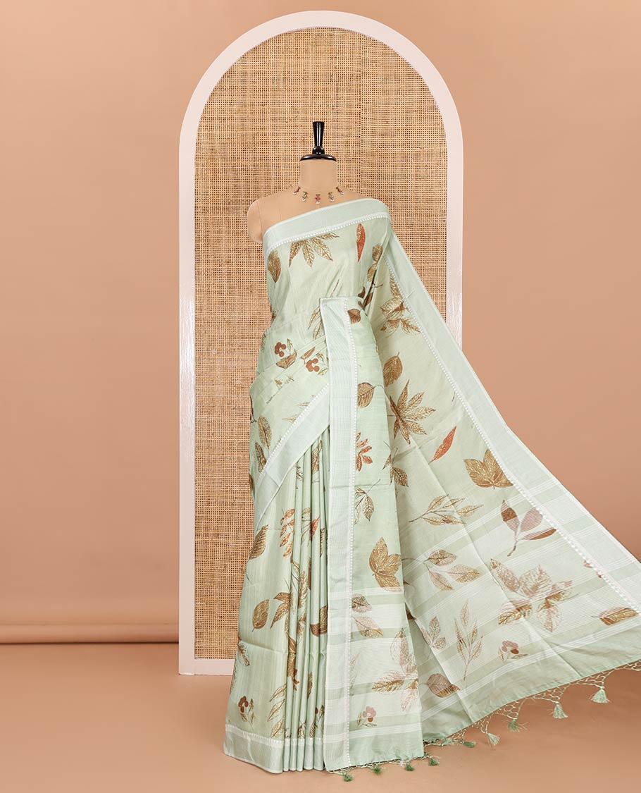 Pista green unique size and shaped leaf motifs printed fancy tussar saree, resham thread woven border, leaf motifs printed pallu, and a matching striped blouse