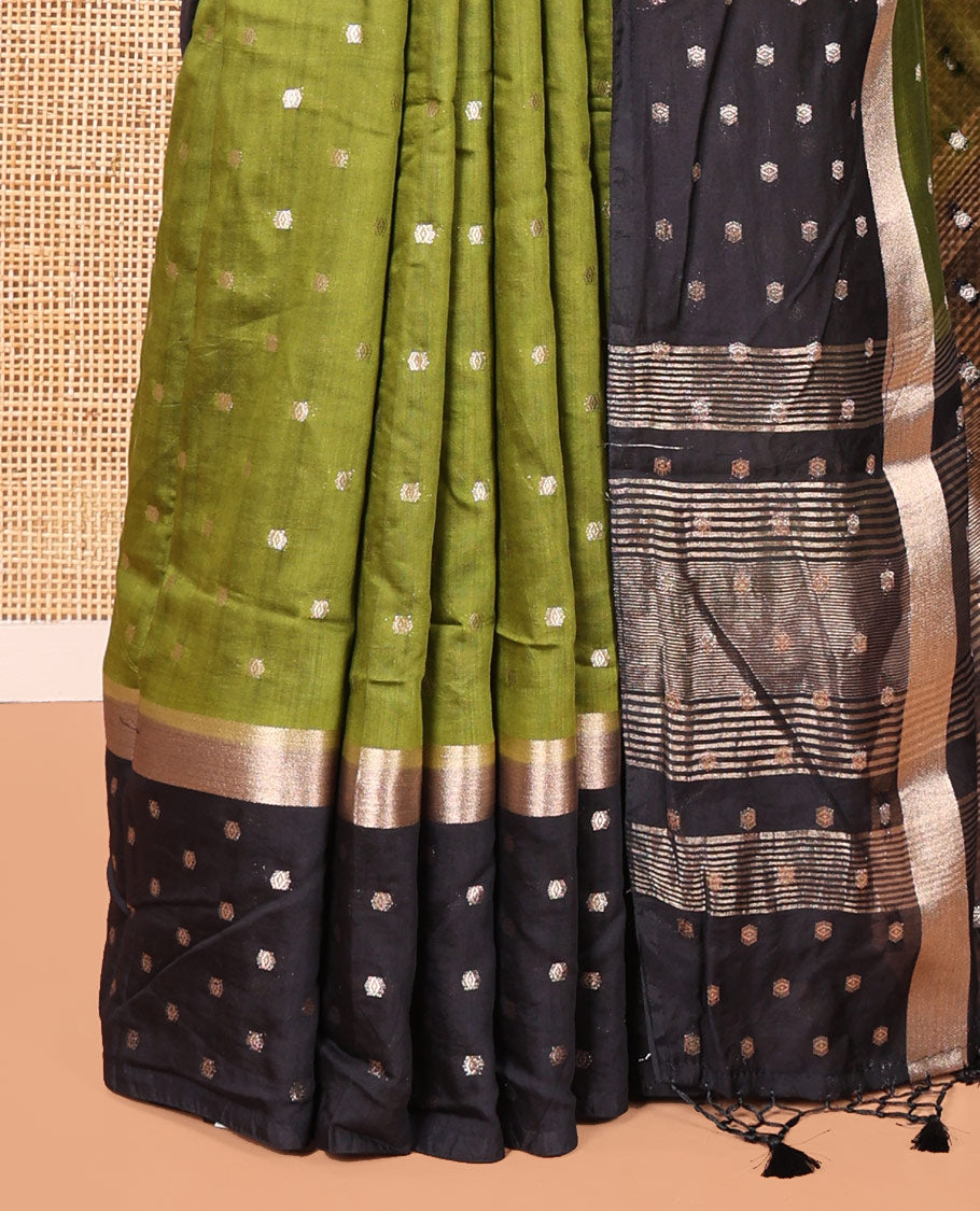 Olive Green Assam Silk Saree, Charmingly Accented with Zari Buttas on Its Body, Complemented by Contrast Border Steeped with Zari Buttas, Pallu Steeped with Gleaming Zari Stripes and Buttas, and Paired with a Contrast Blouse