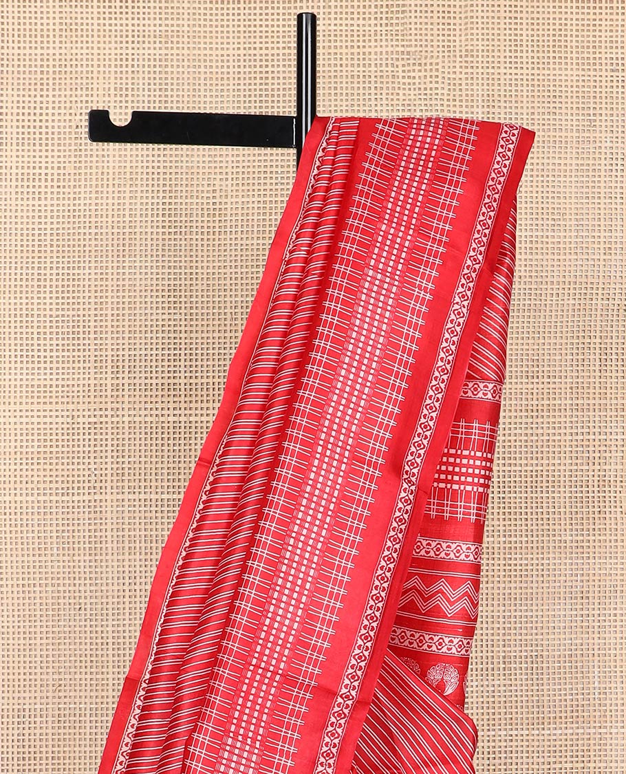 Red geometric design printed silk saree with self intricate design border