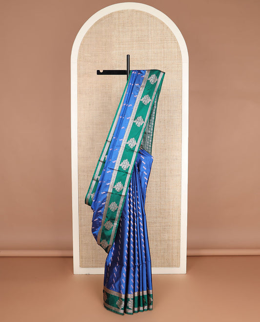 Blue zari buttas silk saree, contrast traditional zari border, and geometric pallu