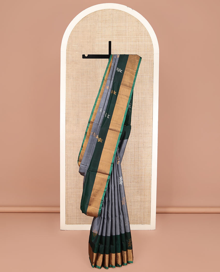 Grey Uppada Silk Saree, Subtly Sparkled with Buttas All Over Its Body, Complemented by a Contrast Bavanji Border of Zari Buttas, Pallu Steeped with Zari Buttas, and Paired with a Contrast Blouse