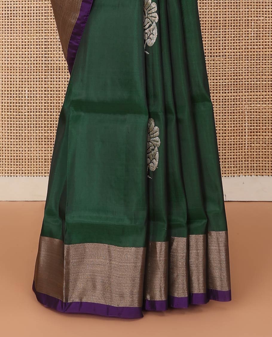 Deep green zari buttas Uppada saree, contrast bavanji border, and jaal patterned pallu