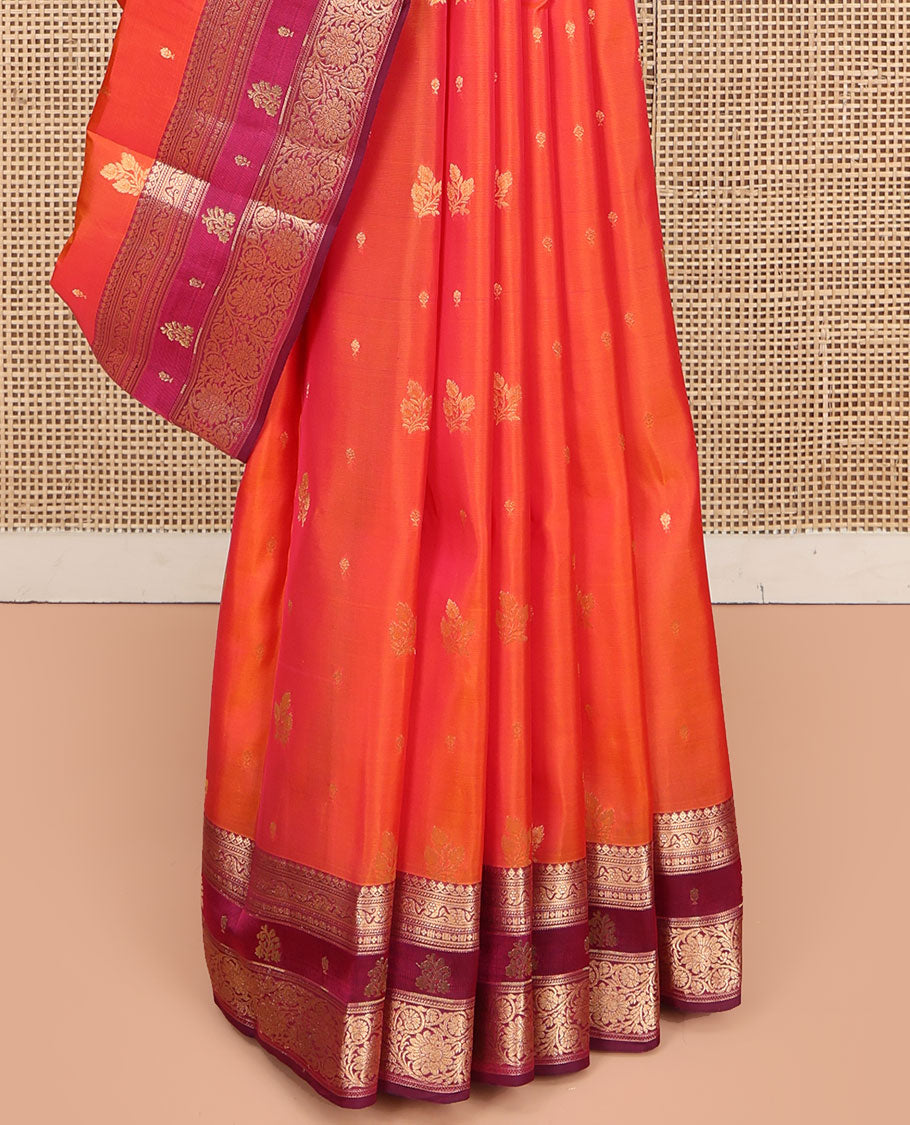 Orange Vasundhara Lite Silk Mix Saree, Accentuated with Zari Buttas, Complemented by a Contrast Border of Thilakam Mokku, and Kodi Visiry Designs, Pallu of Floral Jaal Designs, and Paired with a Contrast Blouse
