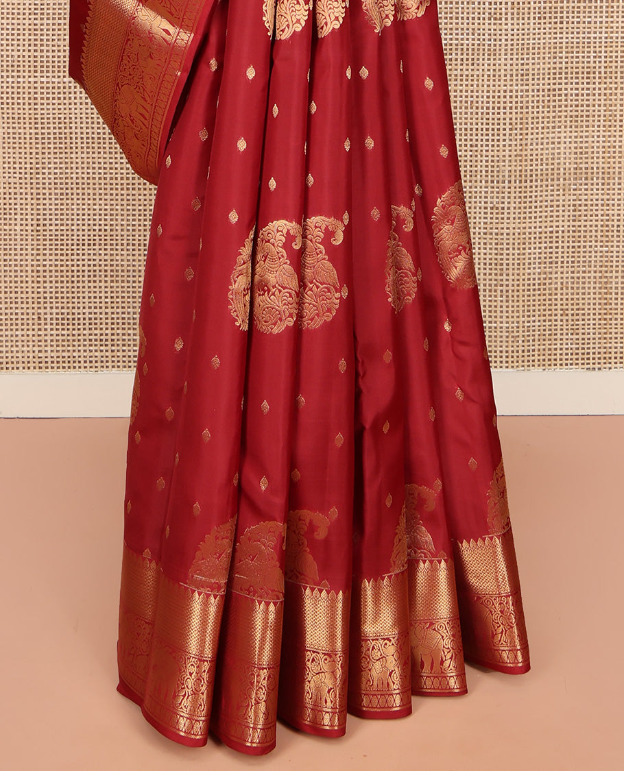 Red Vasundhara Lite Silk Mix Saree, Ornamented with Manga Zari Buttas on Its Body, Highlighted by a Zari Border of Rekku, Yaanai, and Rudraksham Designs, Pallu of Diagonal Designs, and Paired with a Matching Blouse