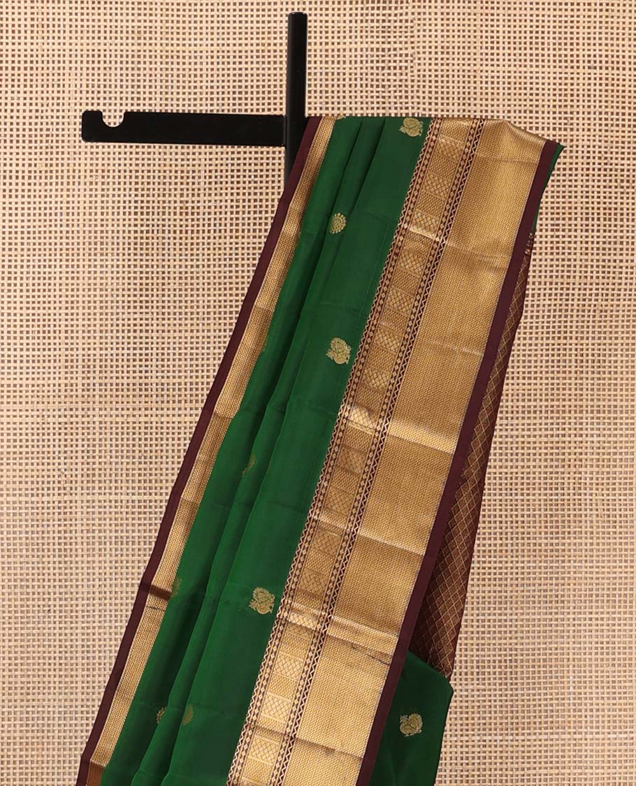 Green annam chakram buttas Vasundhara silk mix saree, contrast border of neli, muthu, rudraksham, paiyaadi kann, and mayil kann designs, and jaal pallu
