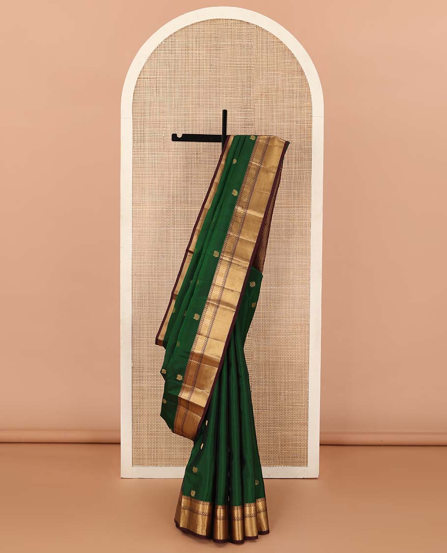 Green annam chakram buttas Vasundhara silk mix saree, contrast border of neli, muthu, rudraksham, paiyaadi kann, and mayil kann designs, and jaal pallu