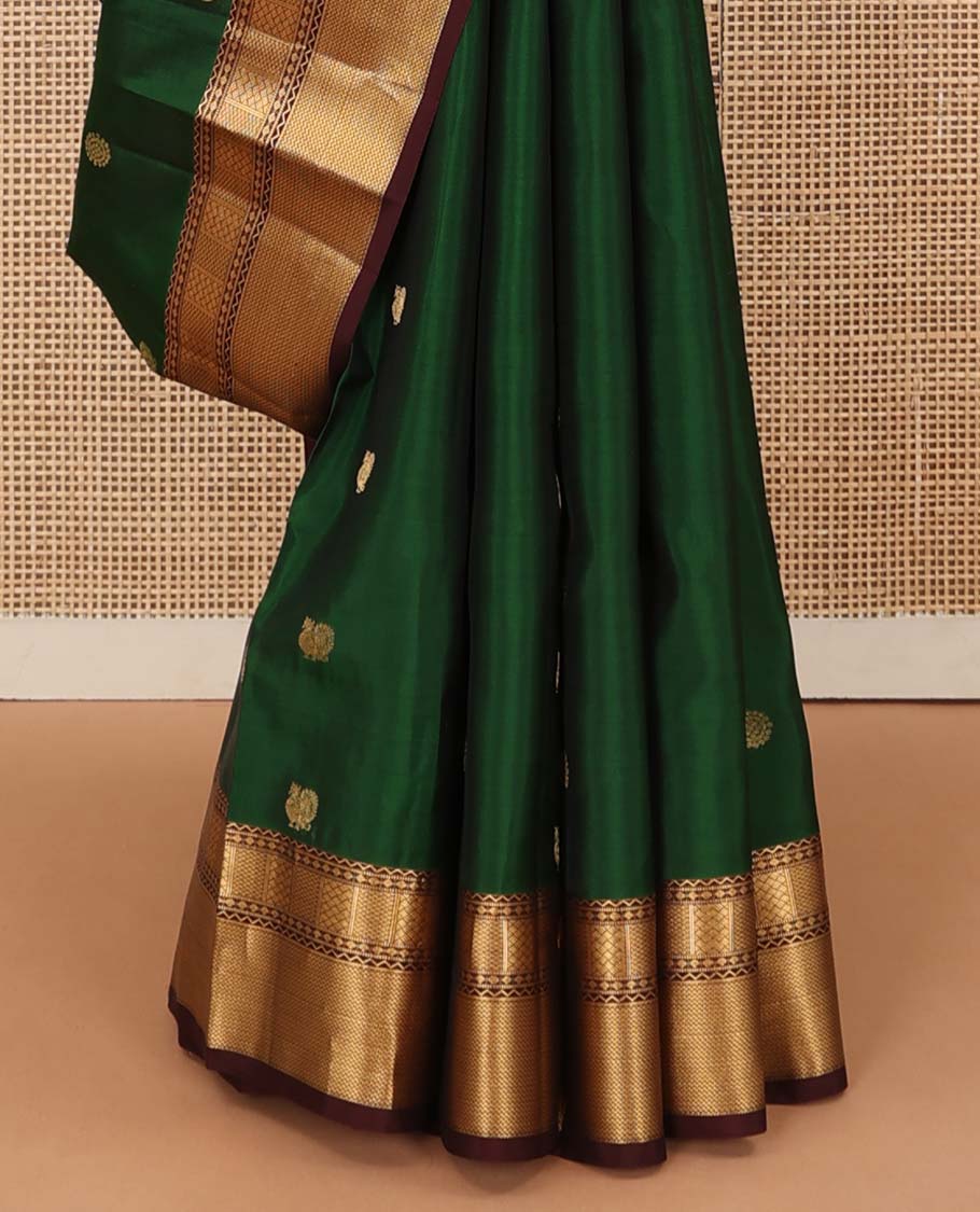 Green annam chakram buttas Vasundhara silk mix saree, contrast border of neli, muthu, rudraksham, paiyaadi kann, and mayil kann designs, and jaal pallu