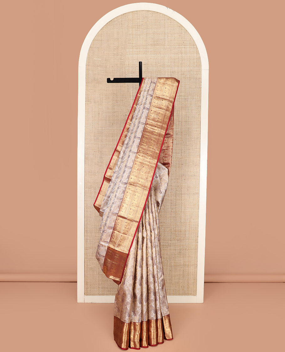 Cream Kanchipuram Silk Saree Artfully Woven with Bird Jacquard Design, Complemented by Contrast Border of Rekku, Mayil, Arumbu Manga, and Chakram Designs, Elegantly Highlighted Pallu of Geometric Patterns, and Paired with a Contrast Blouse